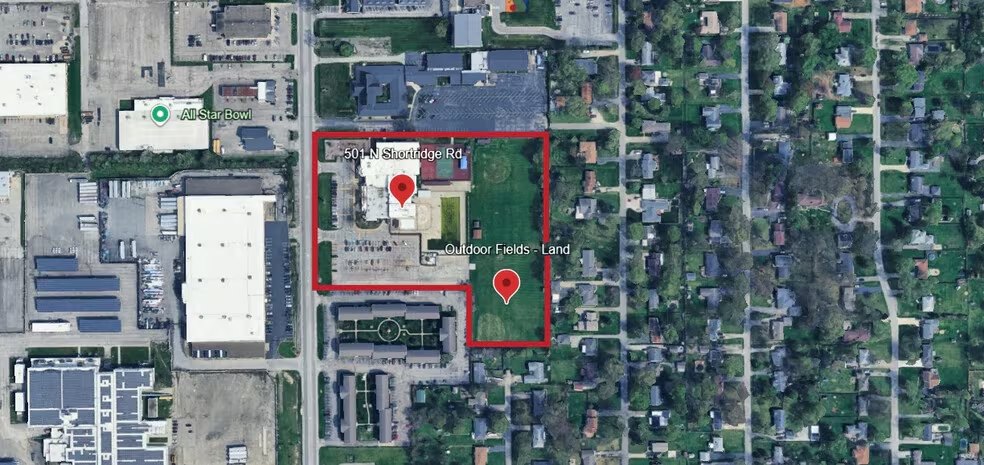 Aerial view of the 8.9-acre site outlined in red